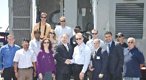 Chapter officers and members of Powerwave Technologies gather following the August luncheon, which covered secure wireless networks.